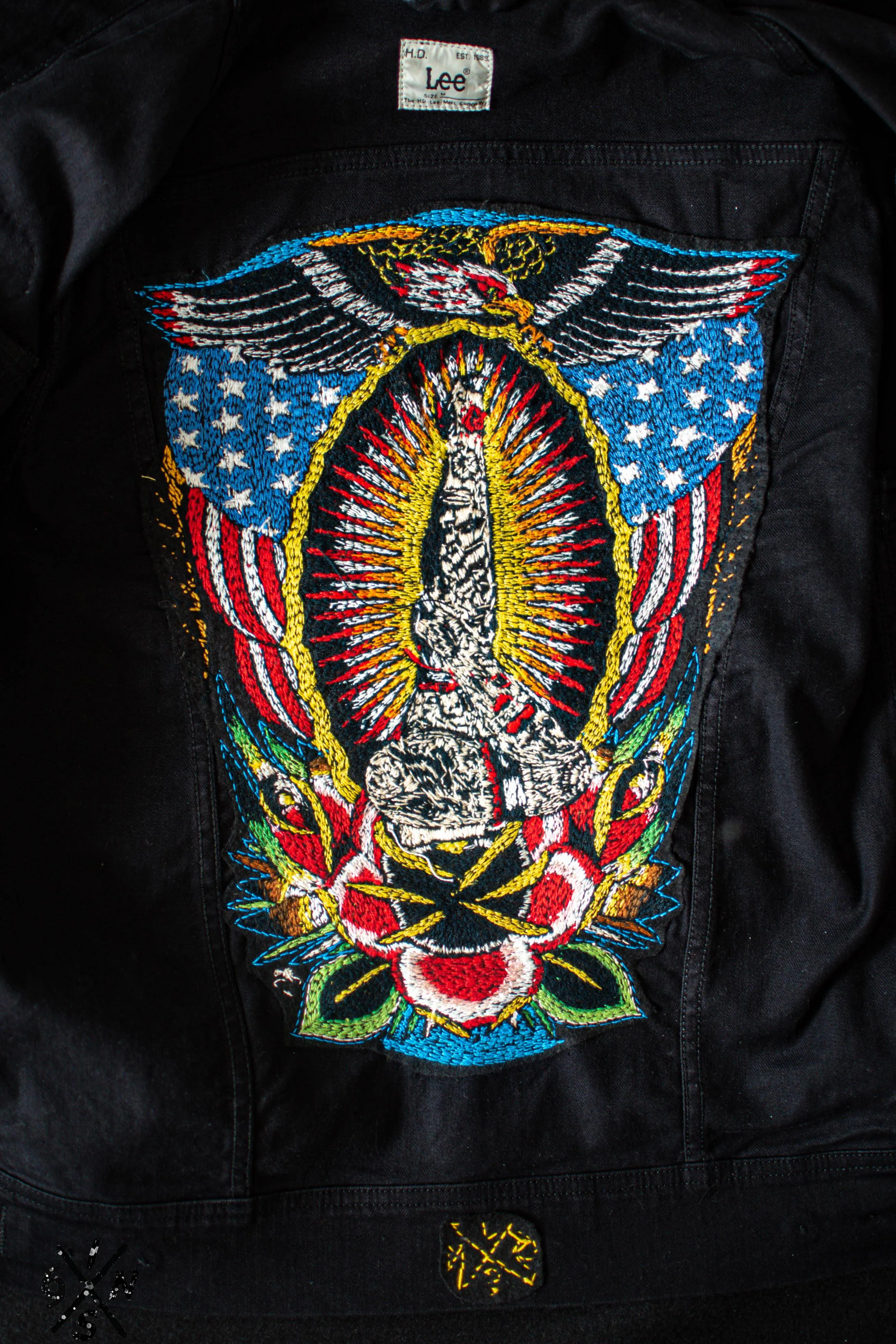 Black denim Lee Riders jacket hand embroidered.