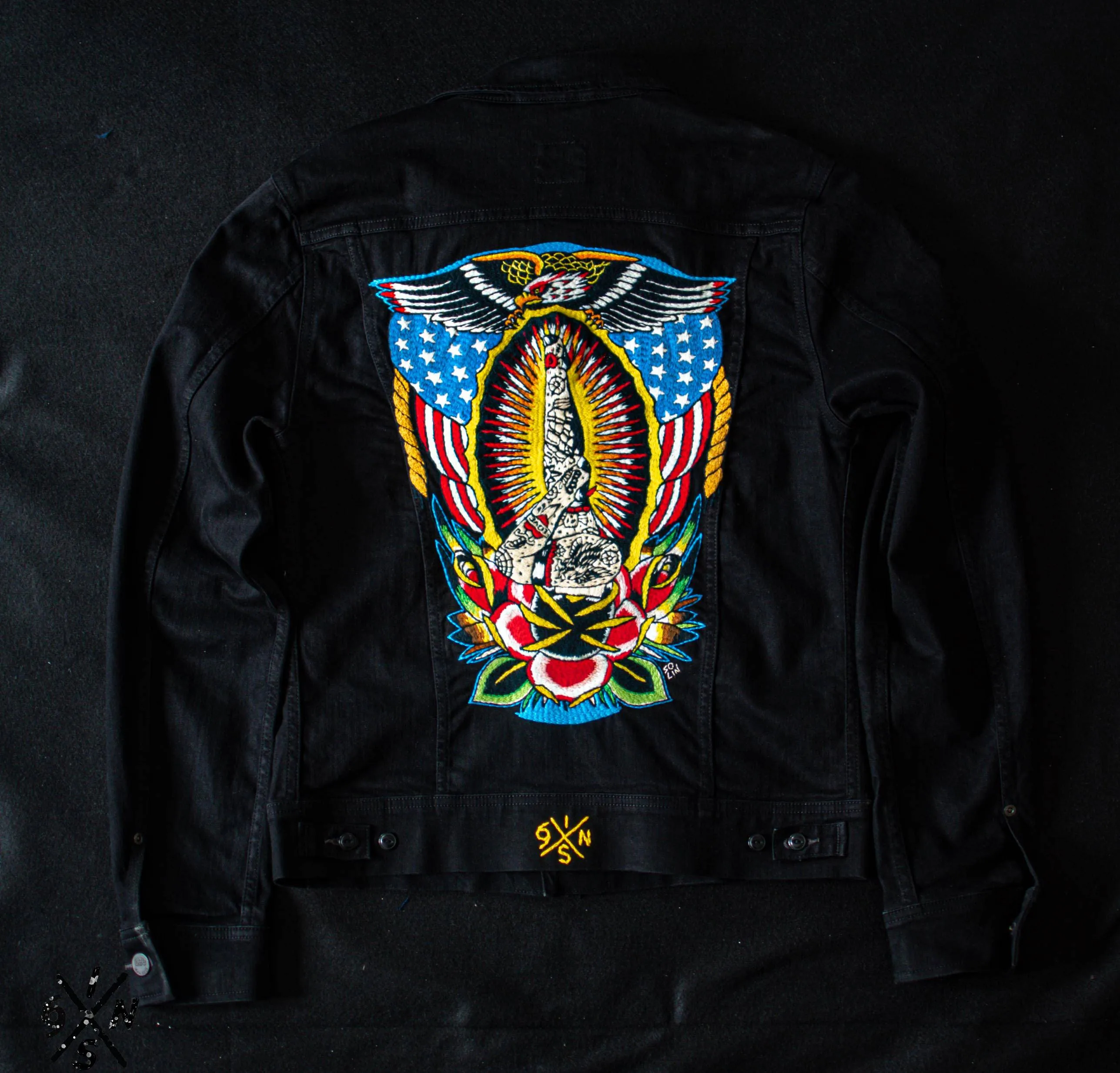 Black denim Lee Riders jacket hand embroidered.